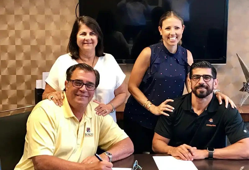 The Rivas family signing the Chifles acquisition papers