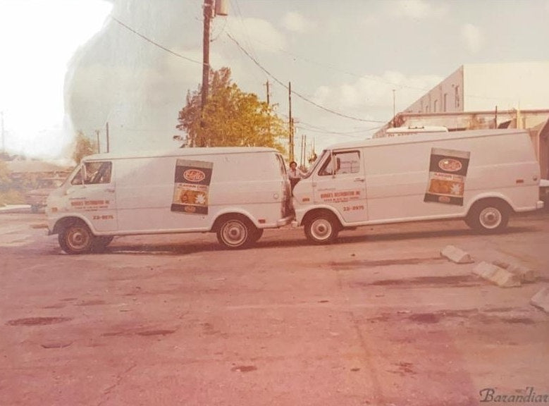 Two Chifles delivery vans parked outside the distribution warehouse in the 1970s